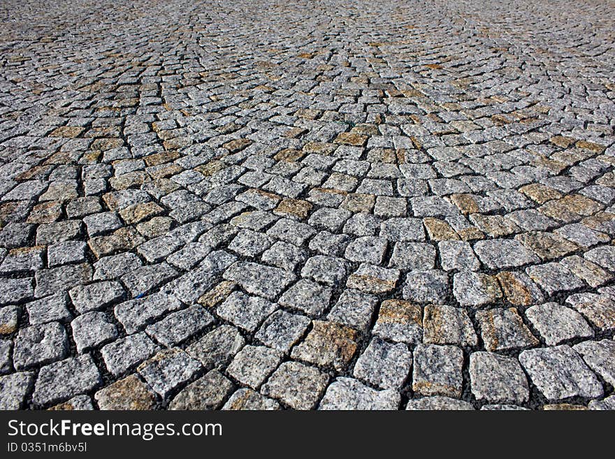 Background of the gray paving stones arranged in a circle. Background of the gray paving stones arranged in a circle