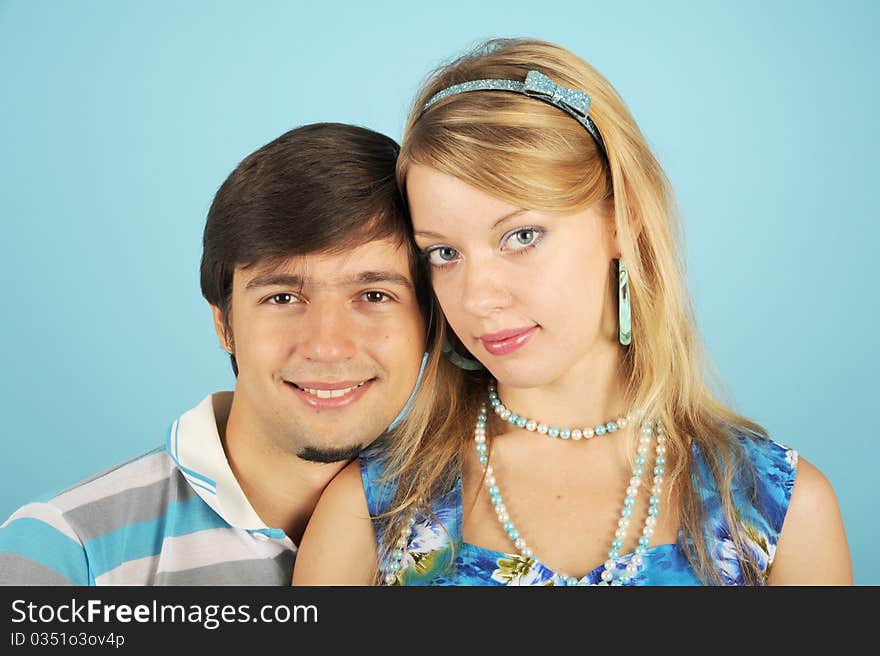 Loving couple against the blue background