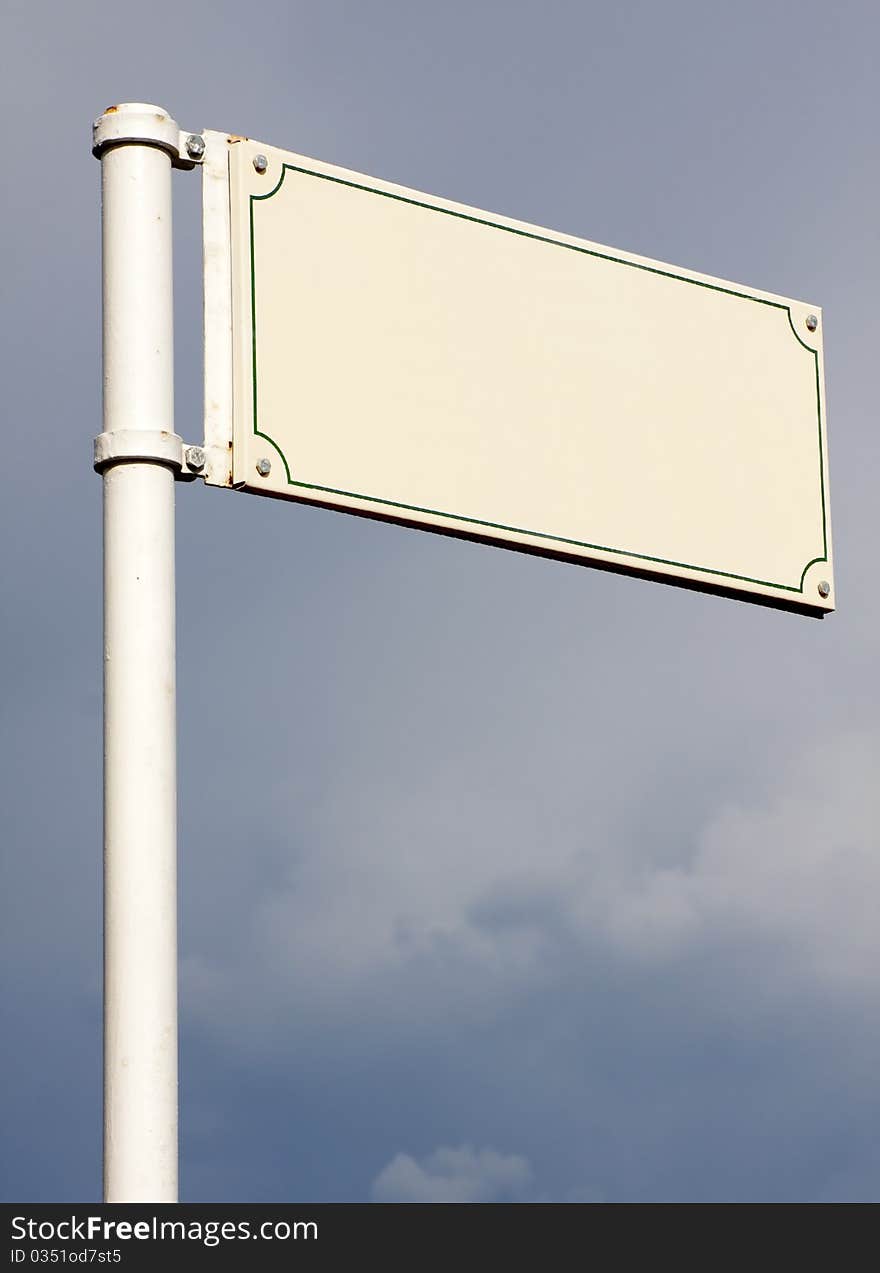 Empty street sign with cloudy background