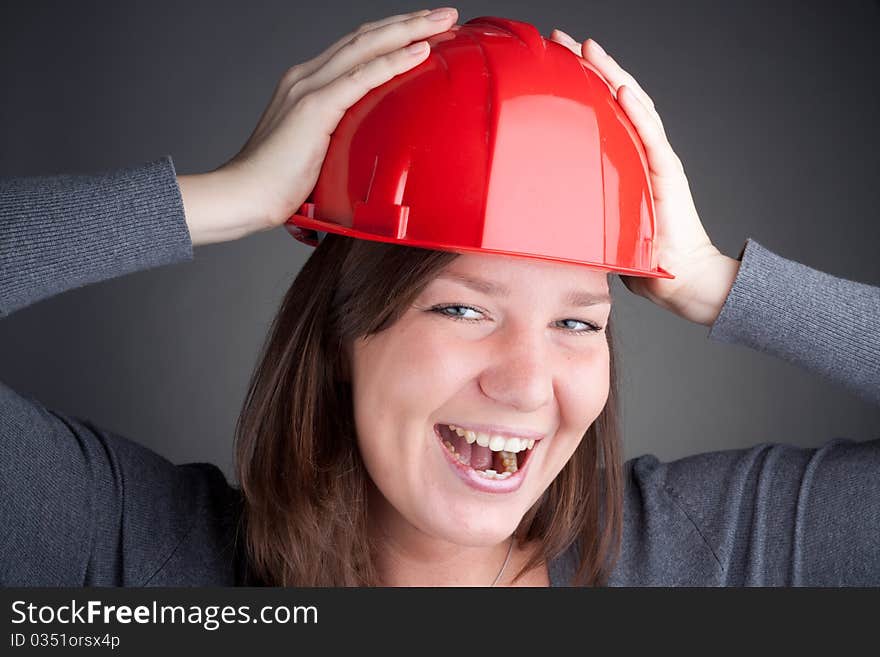 Young architect women wearing red hardhat