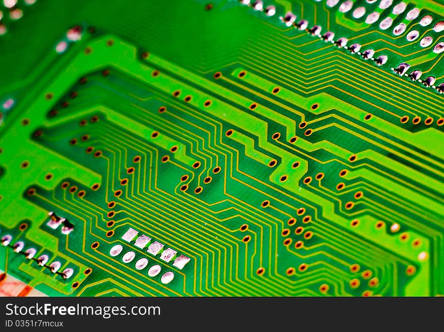 Green and yellow circuit board of computer components in electronic device. Green and yellow circuit board of computer components in electronic device