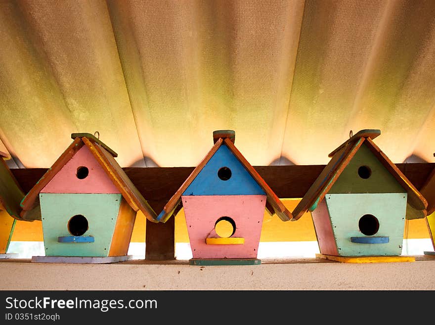 Colorful bird houses under the roof in Thailand