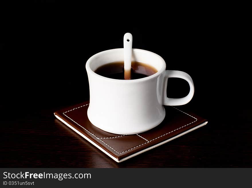 A Cup of tea standing on a table. Studio shot. A Cup of tea standing on a table. Studio shot.