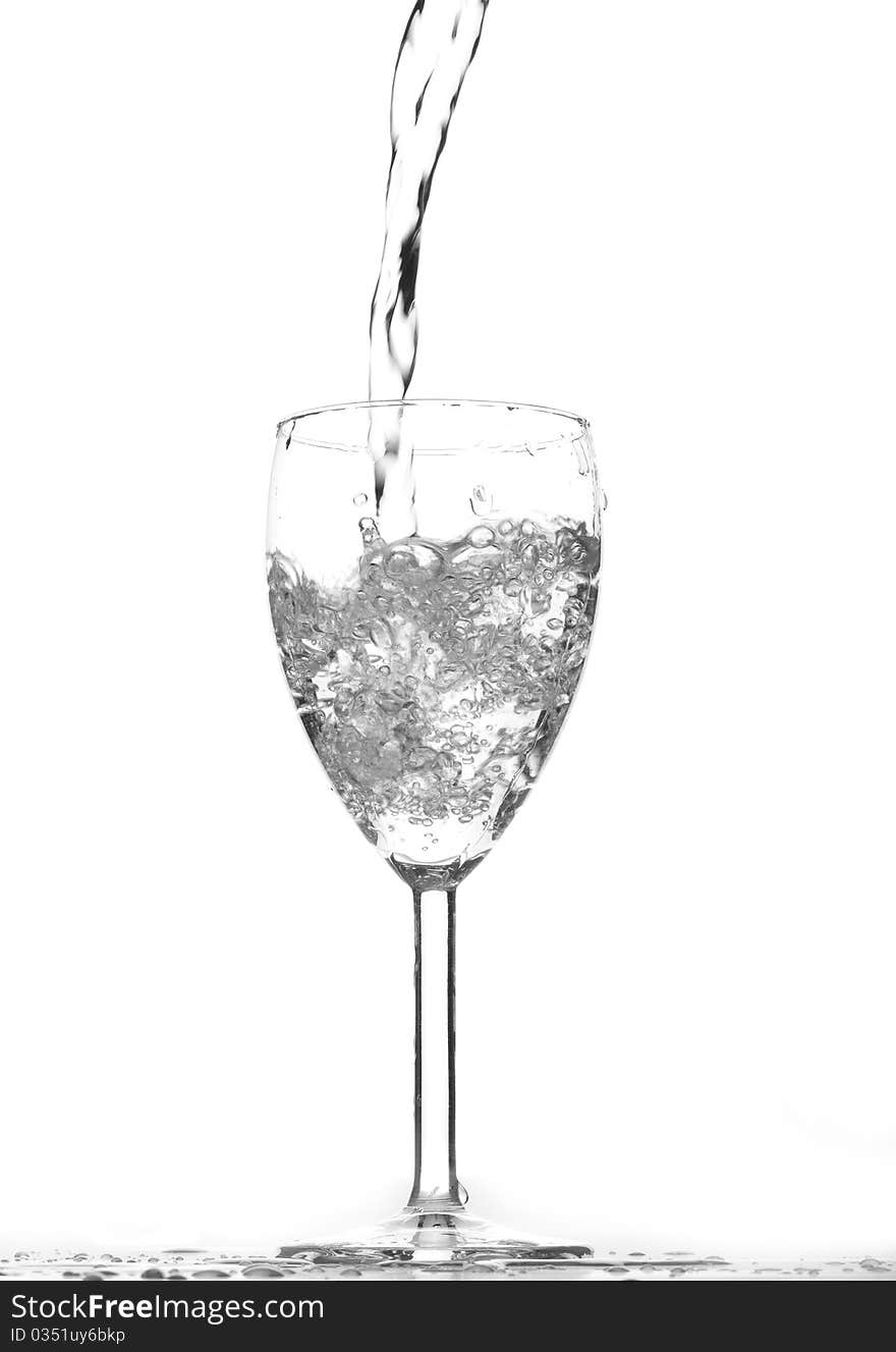 Water in a glass on white background.