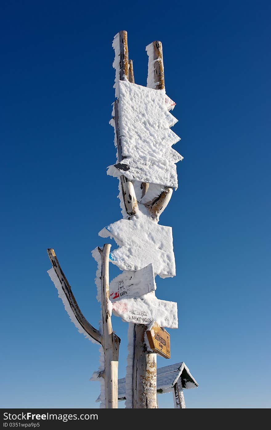 Signpost in the mountains during the winter