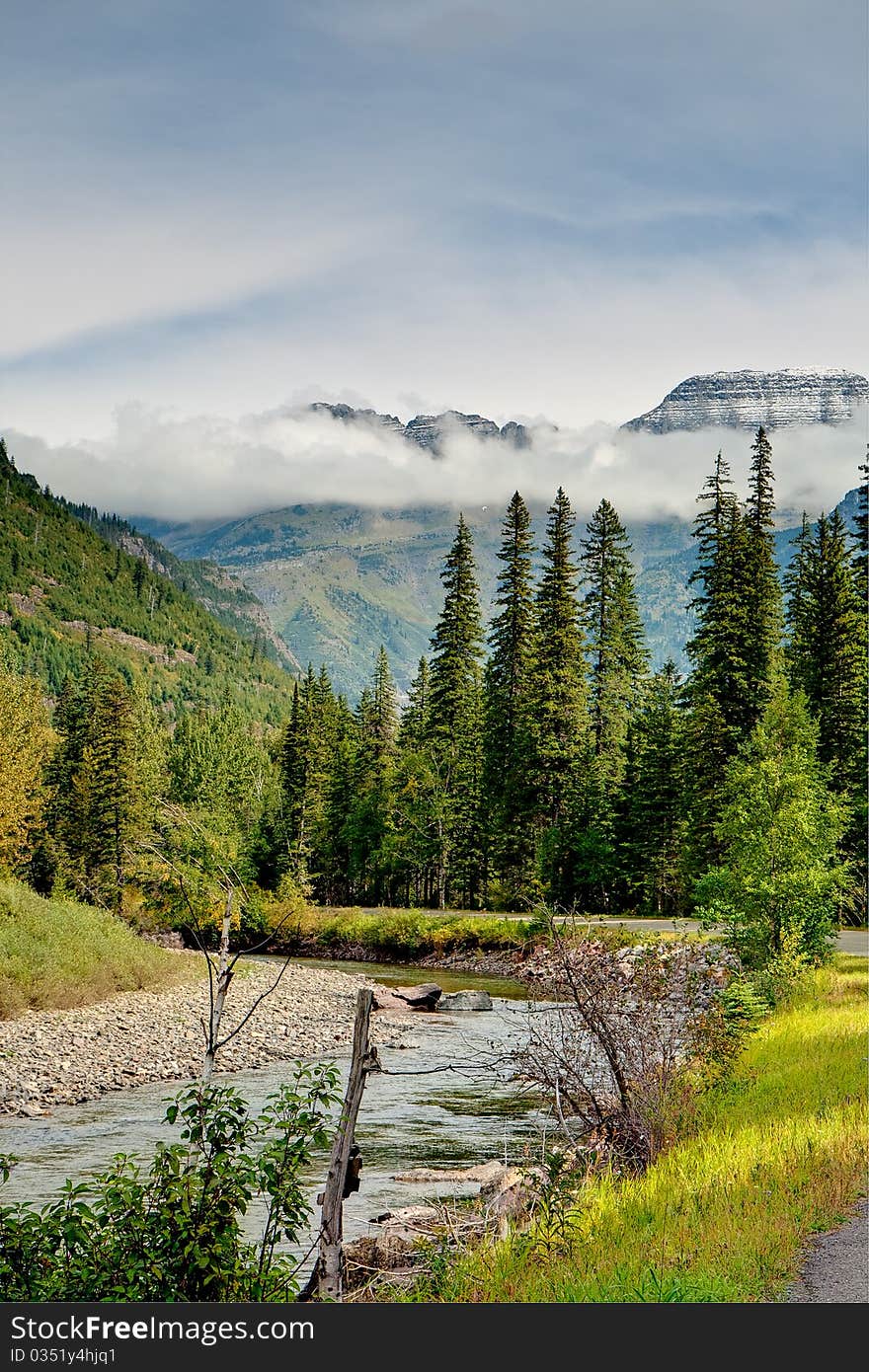 Stream And Cloudy Mt In Glacier