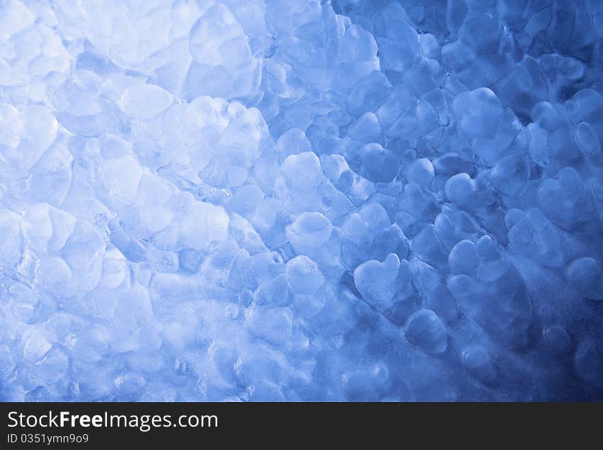 Clear, blue ice formations made in wintertime by a broken water pump. Clear, blue ice formations made in wintertime by a broken water pump