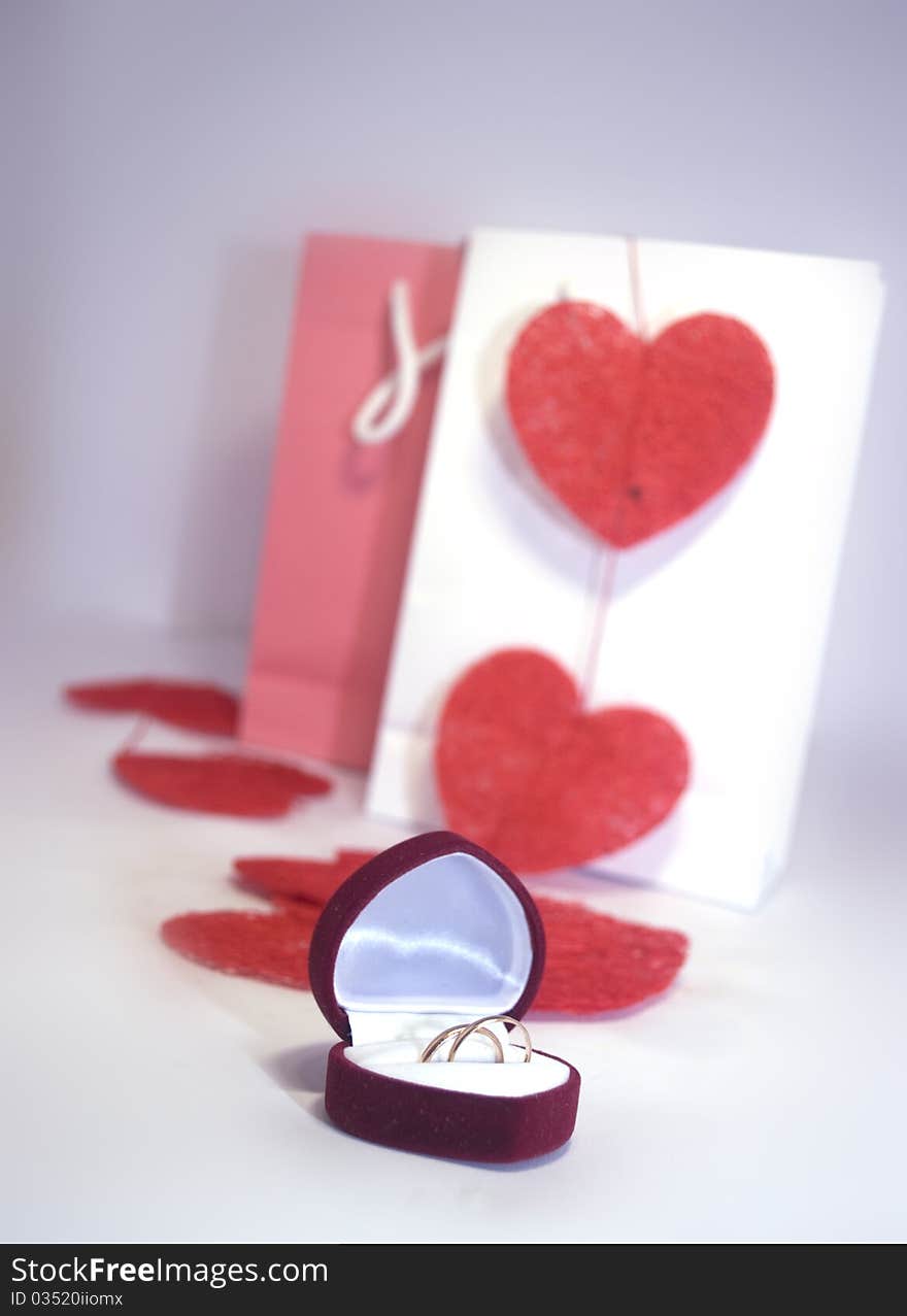 gold ring in a red box, a box in the form of heart. gold ring in a red box, a box in the form of heart