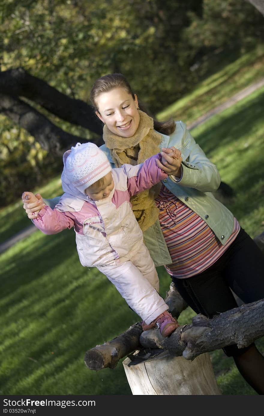 Mother and the daughter play the nature. Mother and the daughter play the nature