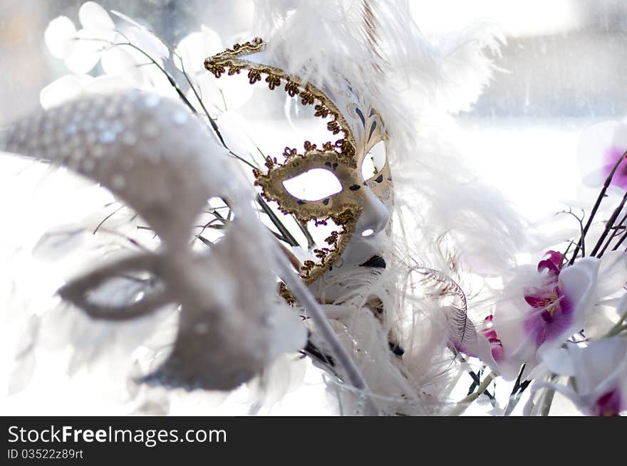 Wedding mask with a white fan and umbrella