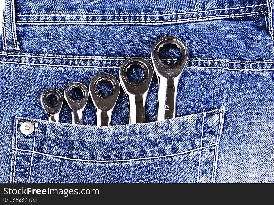 Blue jeans pocket with wrenches