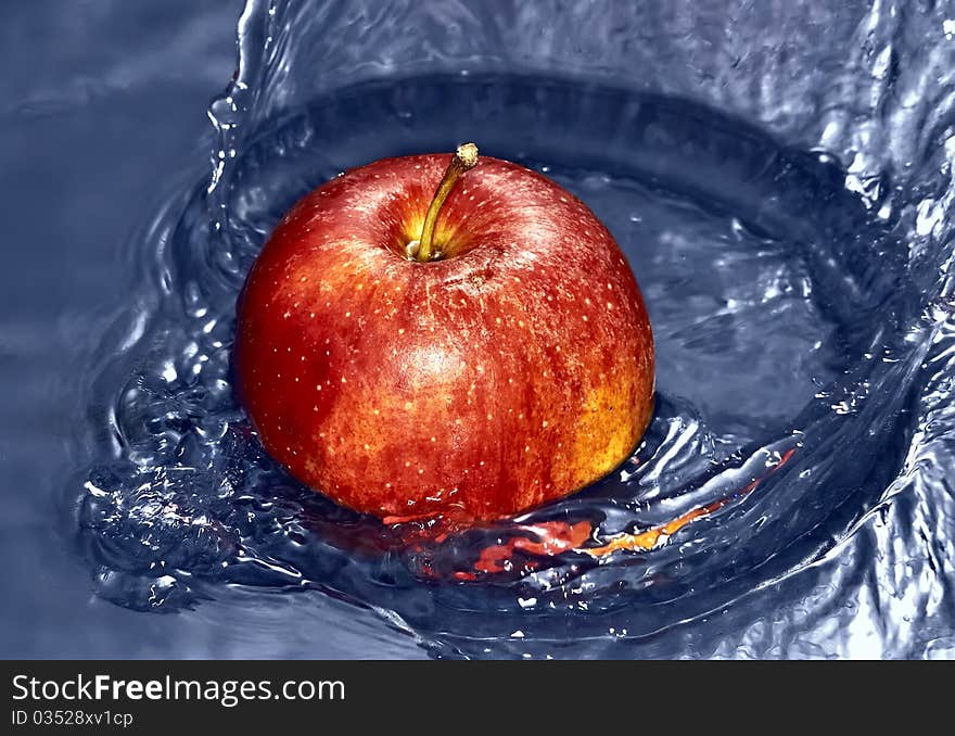 Red Apple in water with splash. Red Apple in water with splash