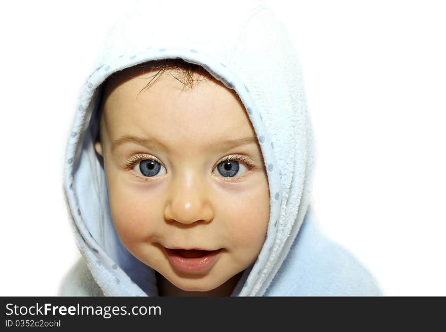 Portrait a baby in a bathrobe after bath. Portrait a baby in a bathrobe after bath