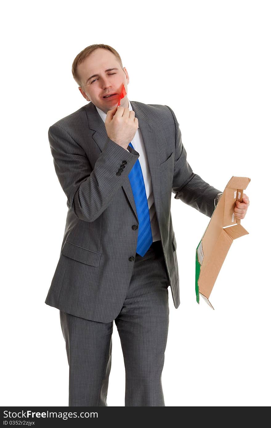 Businessman separates the red tape from his mouth