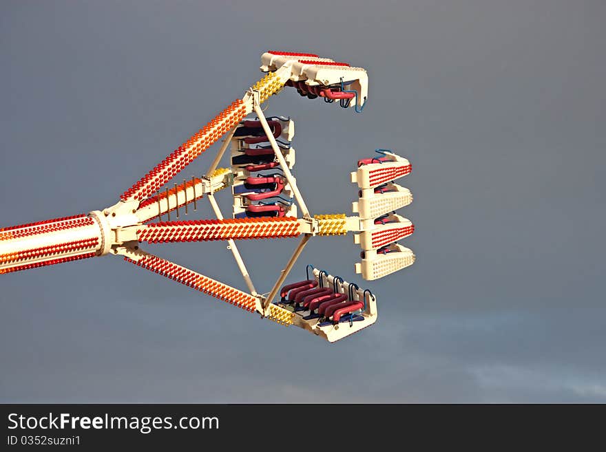 A Thrilling Fun Fair Ride Against a Grey Sky.