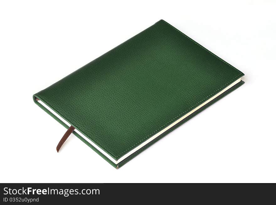 Dark green leather notebook on white background.