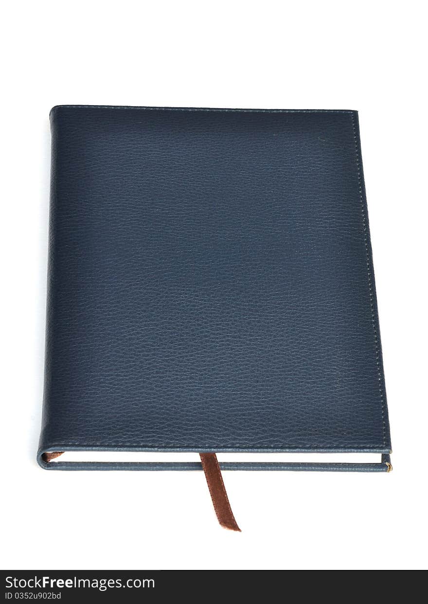 Navy leather notebook on white background.