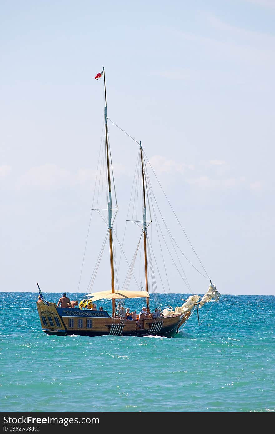 A boat with deflated sails on water of Black Sea. A boat with deflated sails on water of Black Sea.