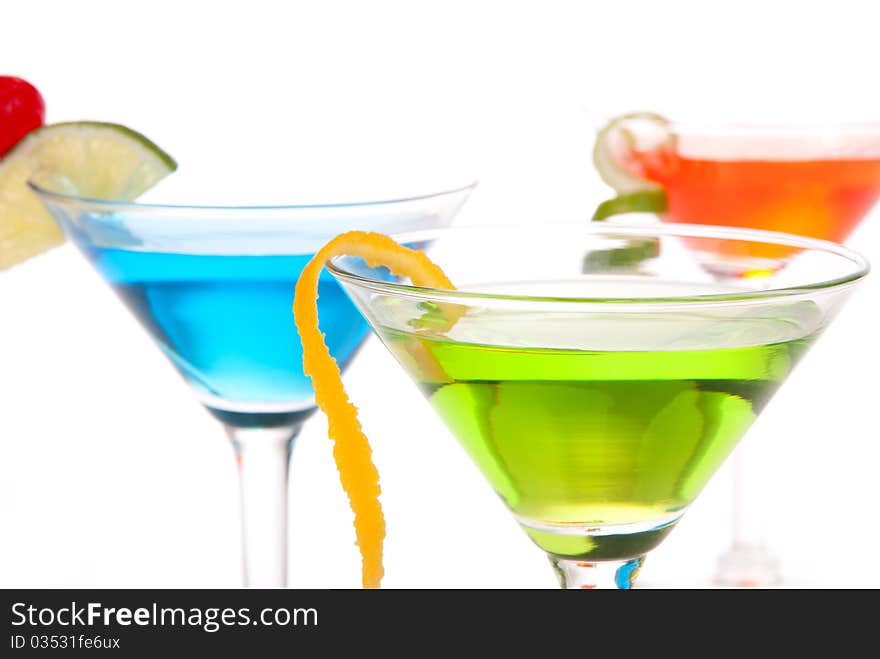 Tropical citrus martini Cocktails with vodka, light rum, gin, tequila, blue curacao, lime juice, lemonade, lemon slice, maraschino cherry isolated on a white background. Tropical citrus martini Cocktails with vodka, light rum, gin, tequila, blue curacao, lime juice, lemonade, lemon slice, maraschino cherry isolated on a white background