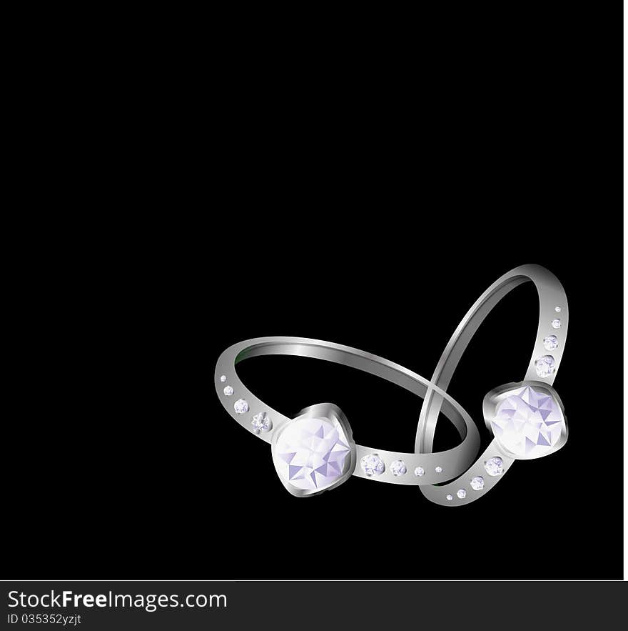 Wedding rings on the black background