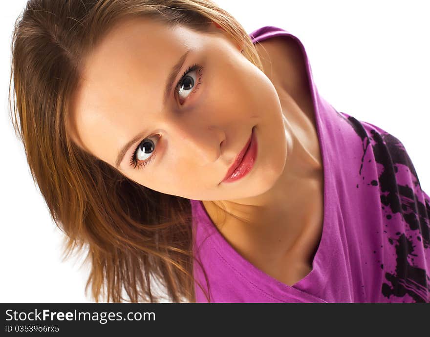 Young girl looking on camera from bottom on white background