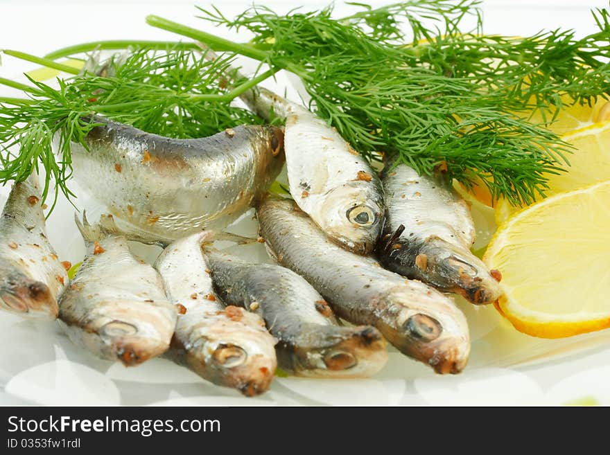 Salted sprats with lemon and dill