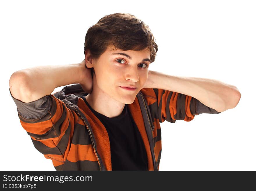 Handsome young man with hands behind the head standing on white background