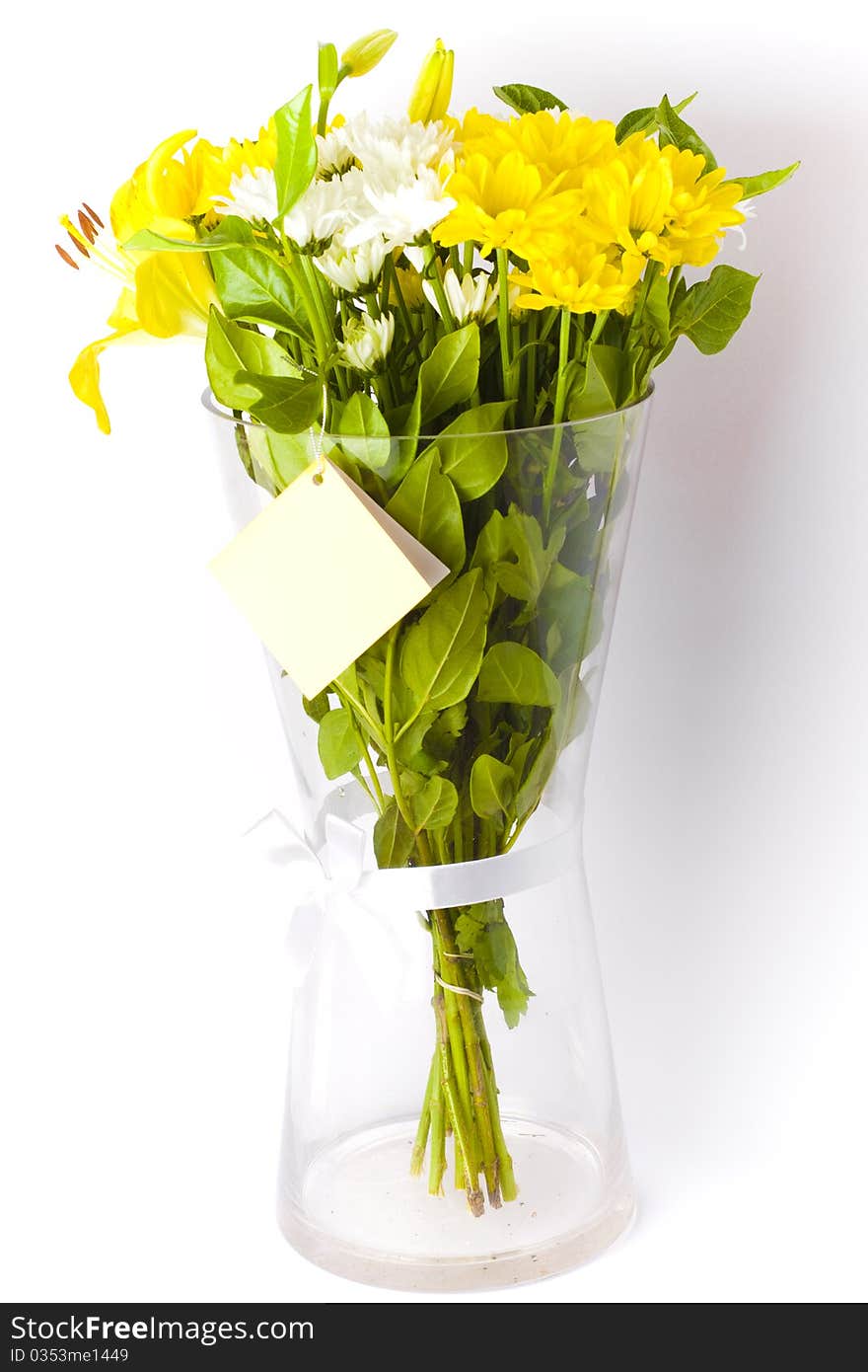 White and yellow floral bouquet in a vase