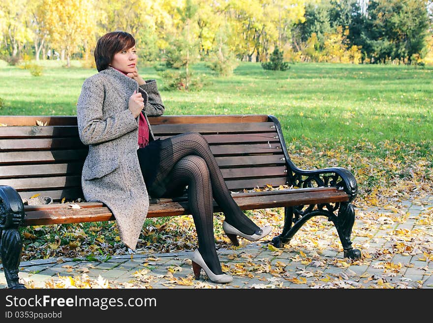 Girl in the park on a bench