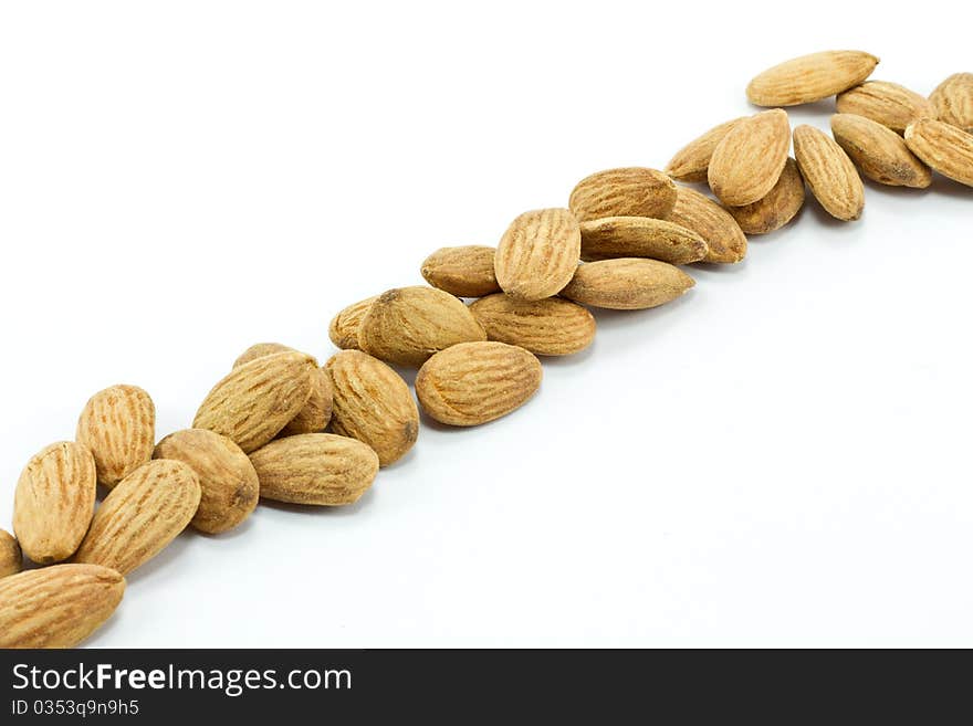 Pile of almonds isolated on white