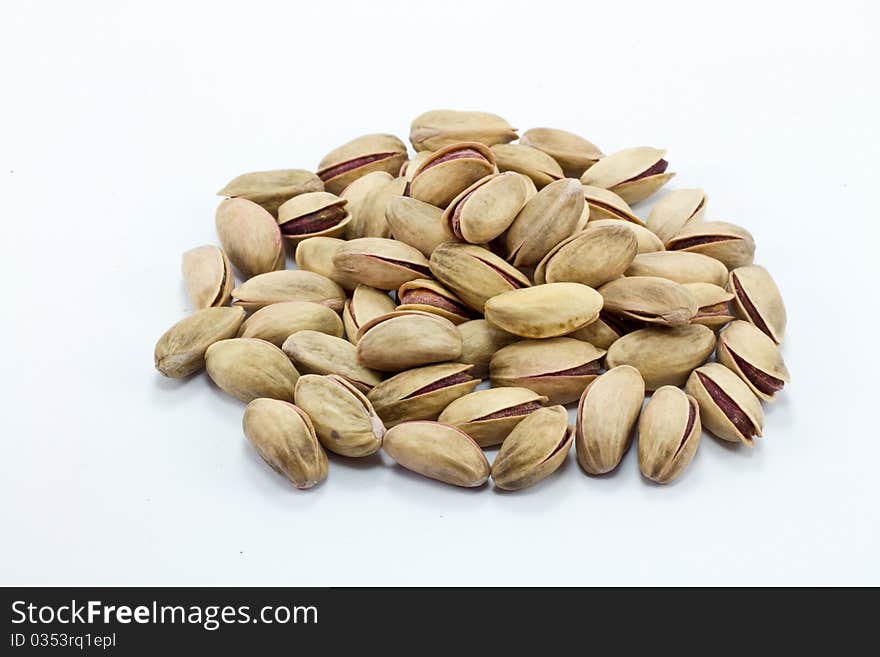 Pistachioile of Pistachio isolated on white