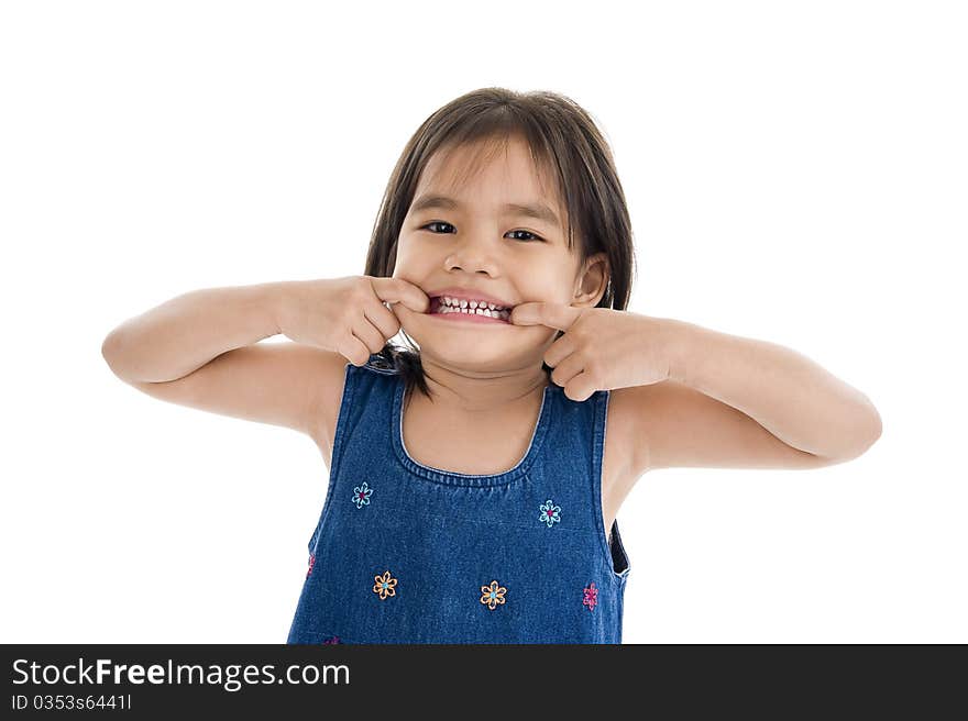 Cute little girl making a grimace, isolated on white background. Cute little girl making a grimace, isolated on white background