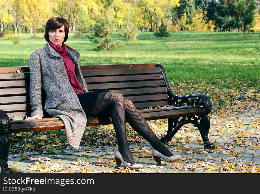 Girl in the park on a bench