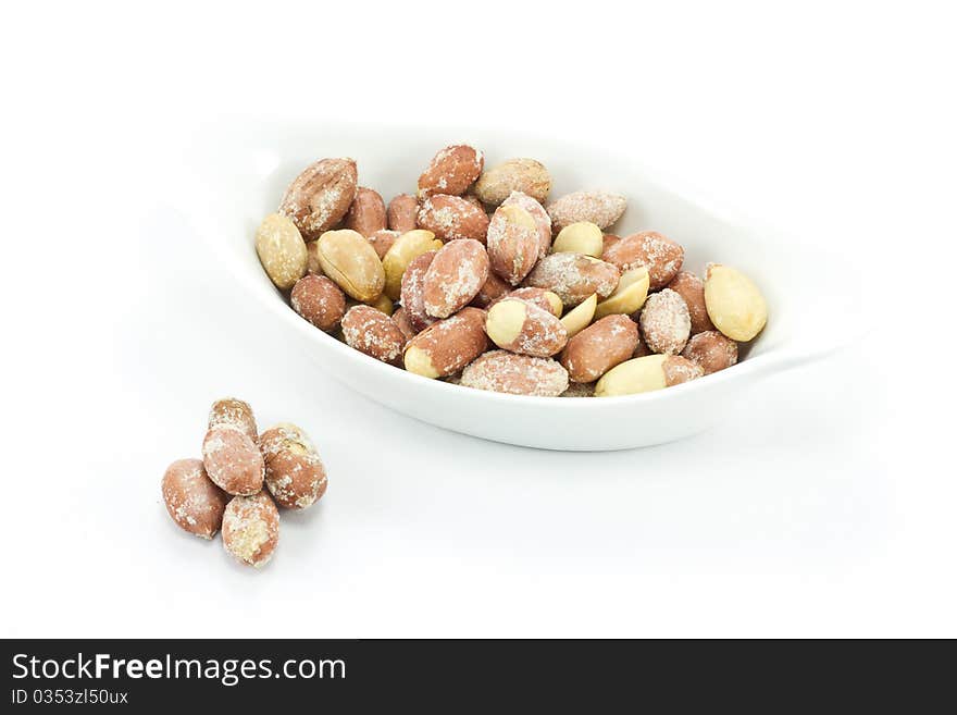 Roasted peanuts isolated on white