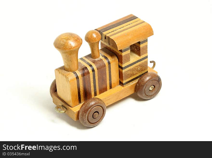 Wooden toy train isolated on white background