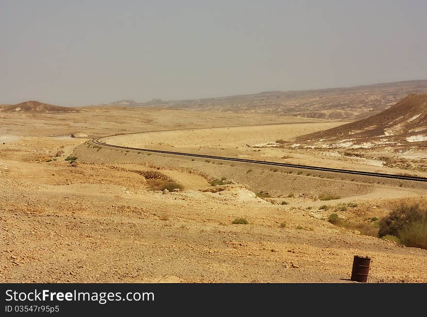 View of a desert mountains and railroad in the Negev desert, Israel. View of a desert mountains and railroad in the Negev desert, Israel