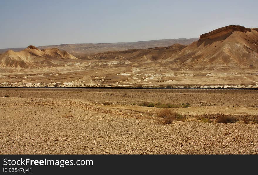 View of a desert mountains and railroad  in the Negev desert, Israel. View of a desert mountains and railroad  in the Negev desert, Israel