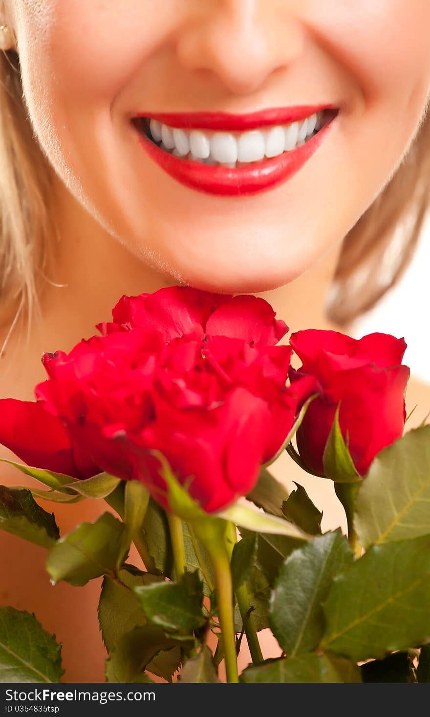 Beautiful caucasian woman with red roses on white isolated background. Beautiful caucasian woman with red roses on white isolated background