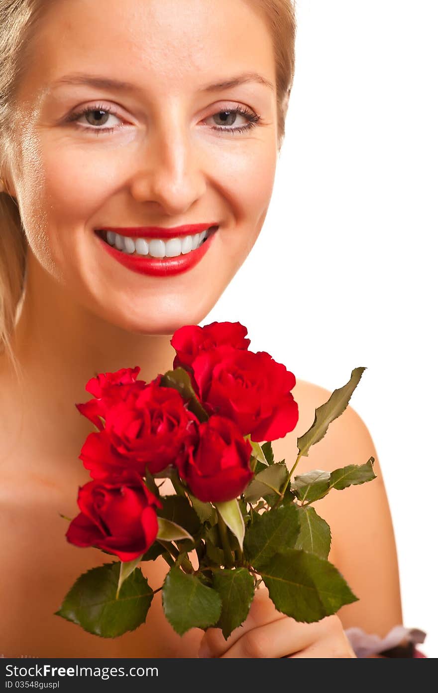 Beautiful caucasian woman with red roses isolated