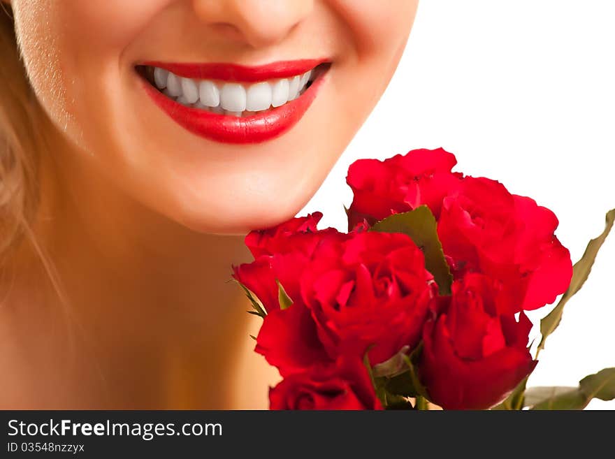 Beautiful caucasian woman with red roses isolated