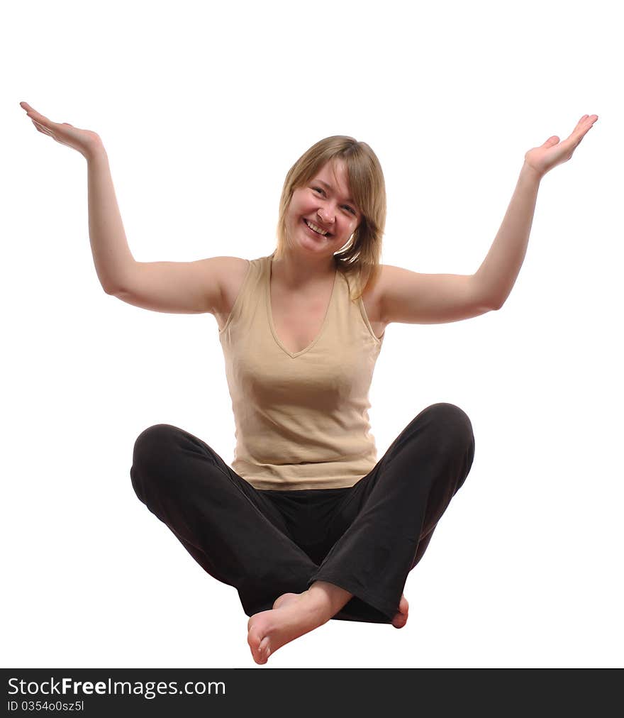 Sitting girl in good mood holding an imaginary object against white background. Isolate studio shot. Sitting girl in good mood holding an imaginary object against white background. Isolate studio shot