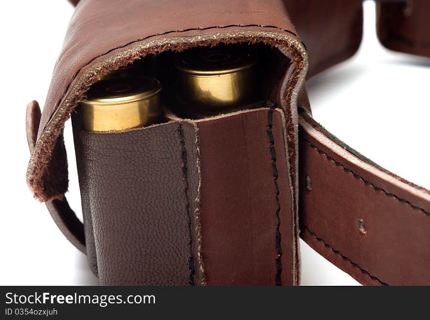 Brown leather bandolier of bullets on a white background. Brown leather bandolier of bullets on a white background.