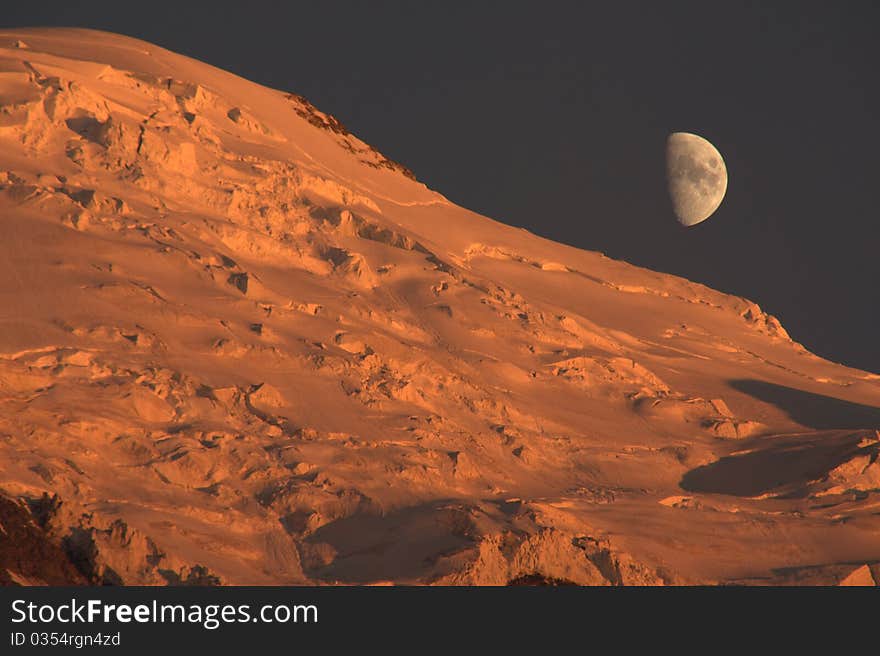 Moon rising as sun is setting. Moon rising as sun is setting