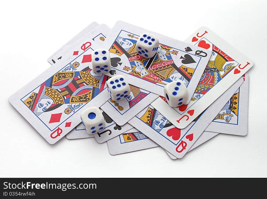 Gambling with playing cards and dice over a white background.