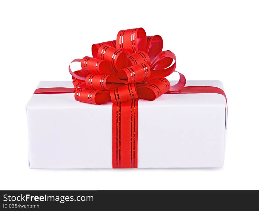 Gift decorated with a red bow on a white background