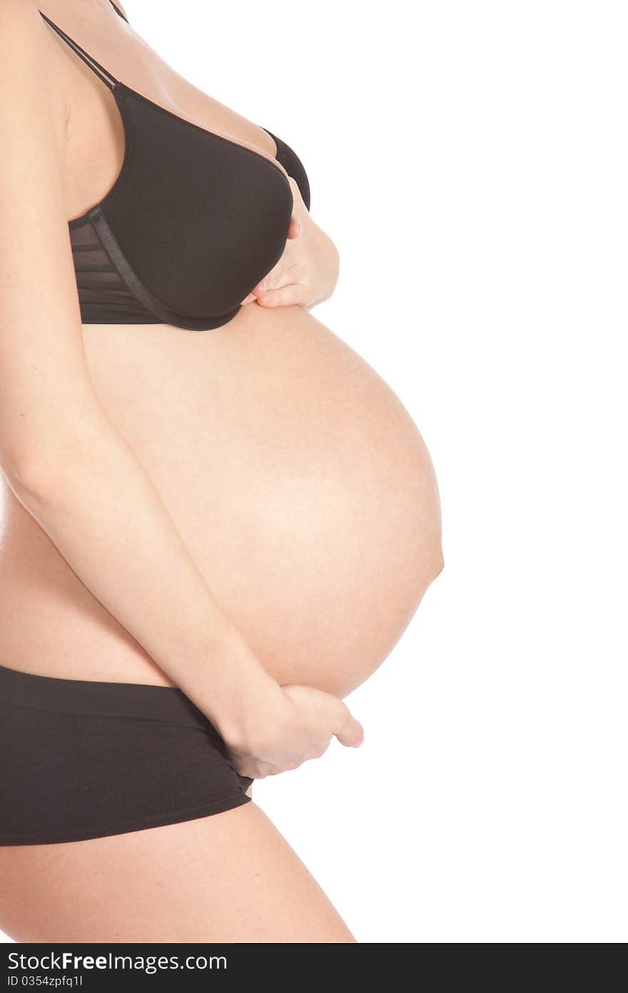 Pregnant tummy on an isolated white background. Pregnant tummy on an isolated white background