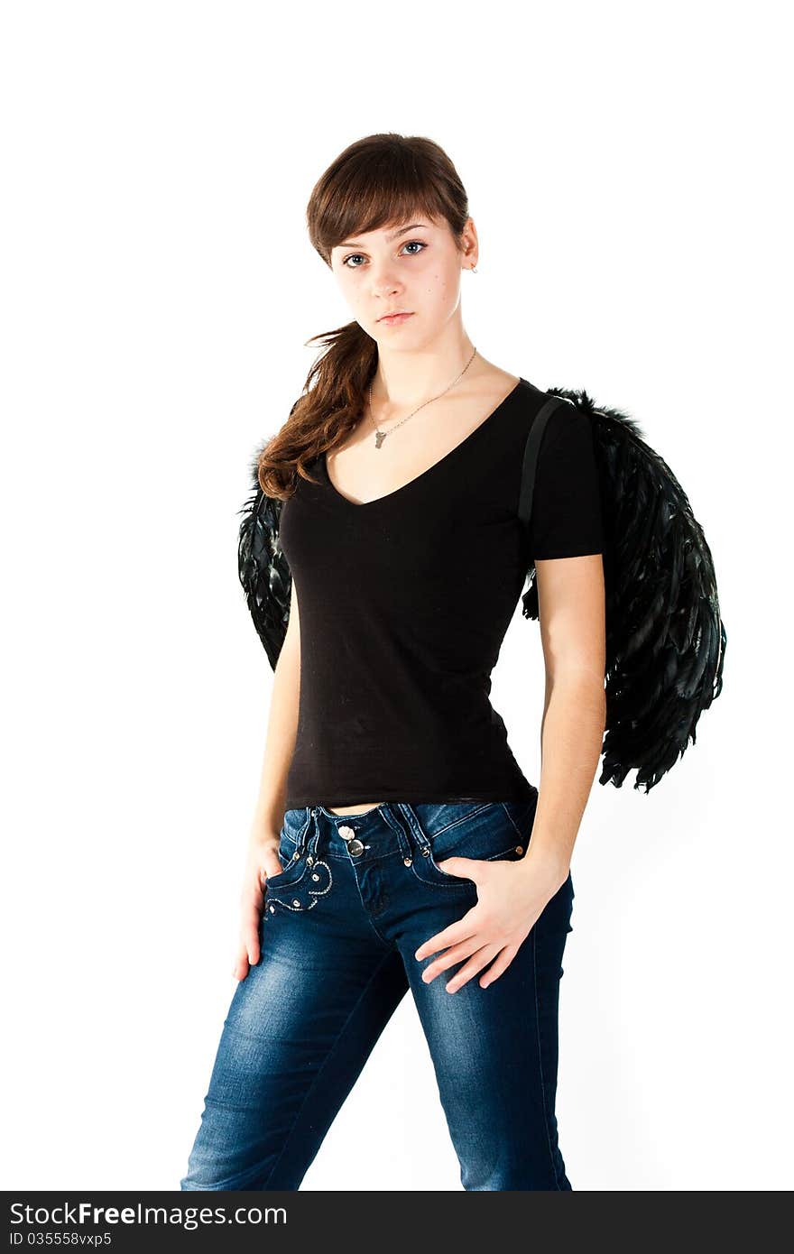 Beautiful girl standing in black wings