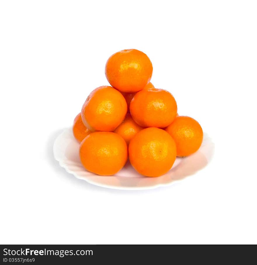 Tangerines on white background are shown in the picture. Tangerines on white background are shown in the picture.