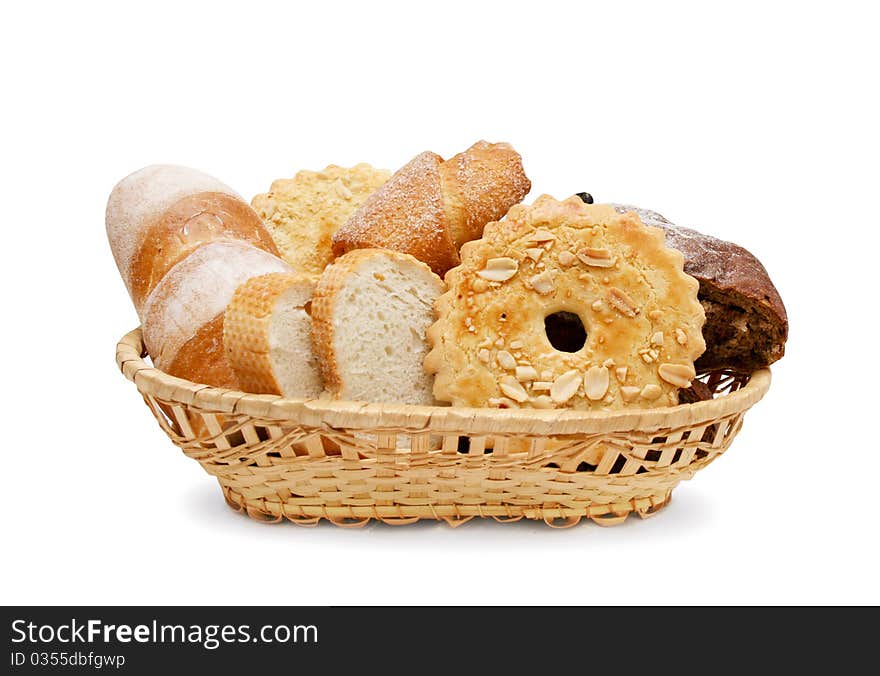 Basket of various fresh baked bread isolated on the white