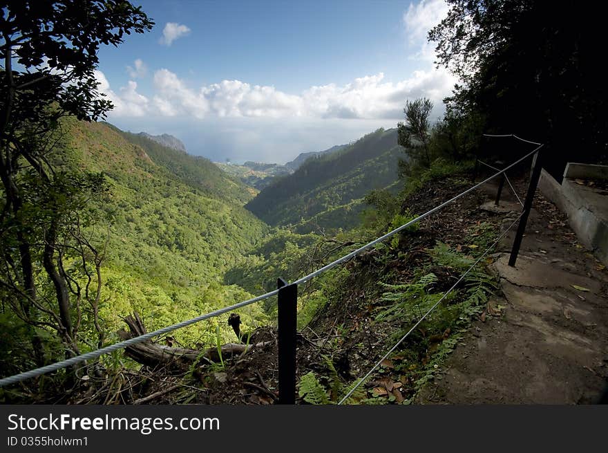 View from a valley at Madeira with the ocean on the background. View from a valley at Madeira with the ocean on the background